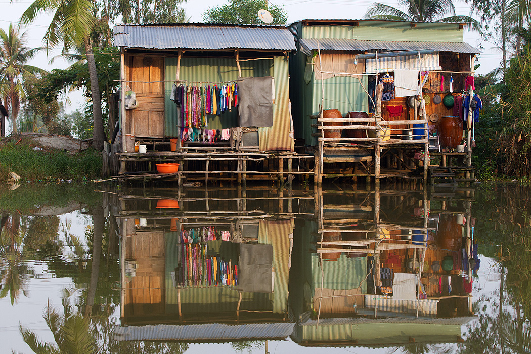 Homes along a canal in Kien Giang province, Vietnam