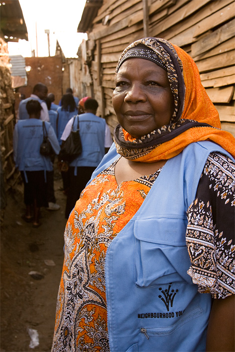 A neighborhood volunteer walks through Kibera Slum in Nairobi, Kenya.