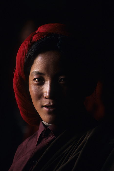 A Tibetan pilgrim wearing traditional headgear