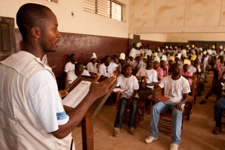 UN Volunteer Roosevelt Zayzay addresses students at Bassa Demonstration School in Liberia