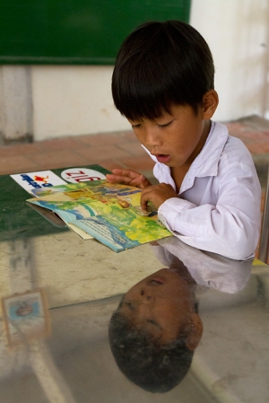 A young boy learns about environmental protection in a school in the Mekong Delta