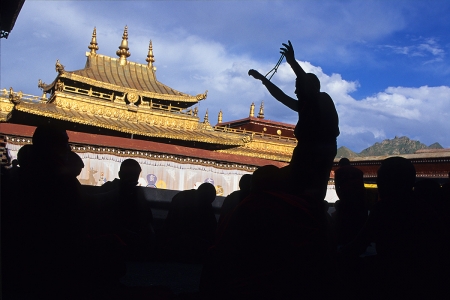 A monk teaches on the roof of the monastery