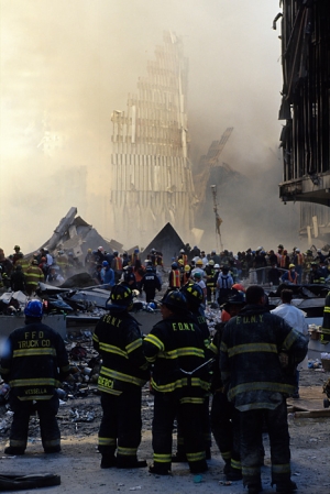 Firefighters stare at the remains of One World Trade Center