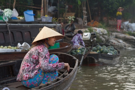 A merchant at the floating market at Can Tho