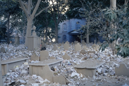 Debris covers the cemetery of St. Paul's Chapel, the oldest church in Manhattan, located just across Church Street from the WTC