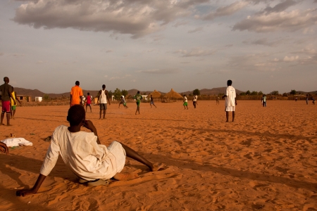Young men play soccer at a refugee camp near Goz Beïda, Chad.