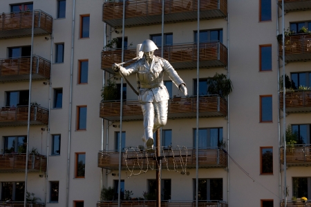 A recreation of the famous photo of a soldier jumping across the barbed wire at what would become the Berlin Wall, erected on th